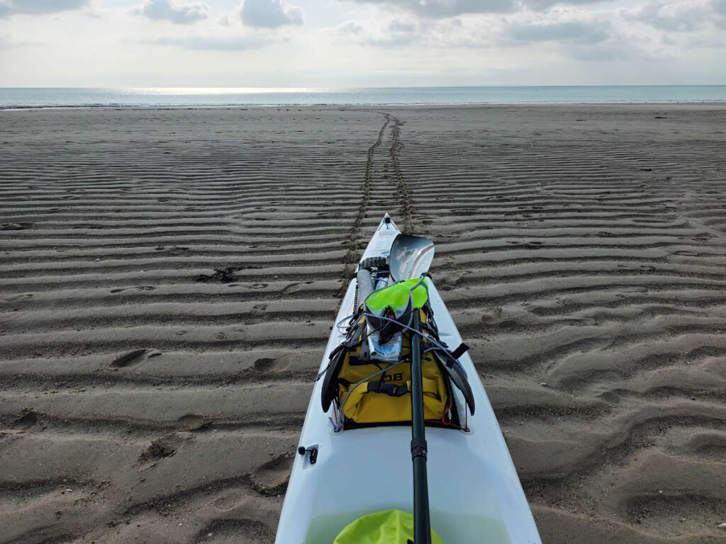 tracks in sand kayak beach expedition